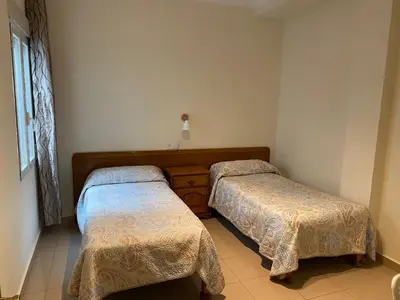 Cama o camas de una habitación en Hostal Retiro