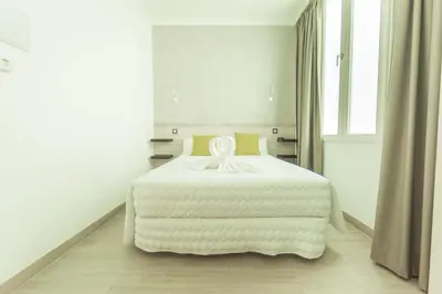 Cama o camas de una habitación en Hostal Pio Centro