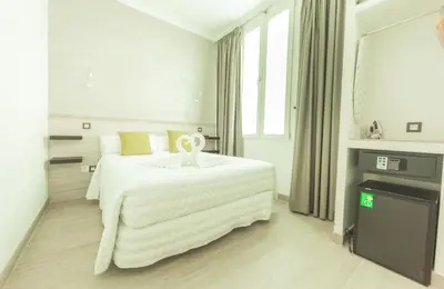 Cama o camas de una habitación en Hostal Pio Centro