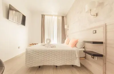 Cama o camas de una habitación en Hostal Pio Centro