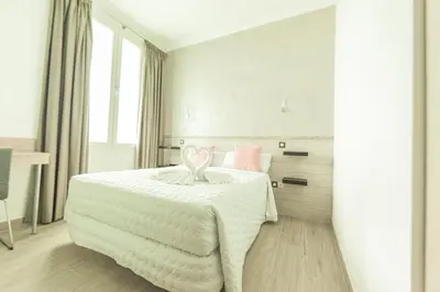 Cama o camas de una habitación en Hostal Pio Centro