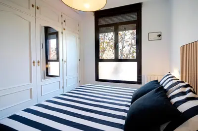 Cama o camas de una habitación en Apartament Glorieta Puerta de Toledo