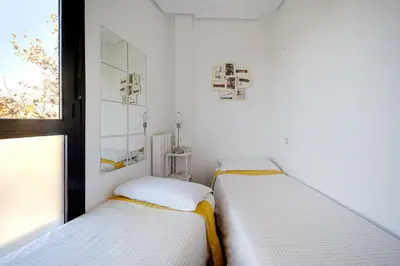 Cama o camas de una habitación en Apartament Glorieta Puerta de Toledo