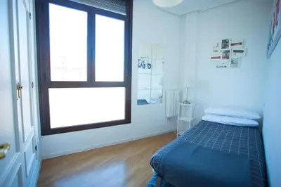 Cama o camas de una habitación en Apartament Glorieta Puerta de Toledo