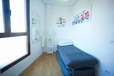 Cama o camas de una habitación en Apartament Glorieta Puerta de Toledo