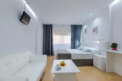 Cama o camas de una habitación en Boutique Urban Madrid Serrano