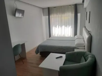 Cama o camas de una habitación en Boutique Urban Madrid Serrano