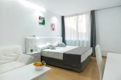 Cama o camas de una habitación en Boutique Urban Madrid Génova