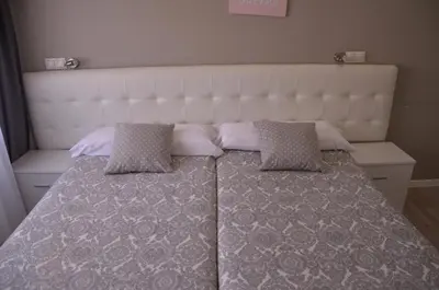 Cama o camas de una habitación en Boutique Urban Madrid Génova
