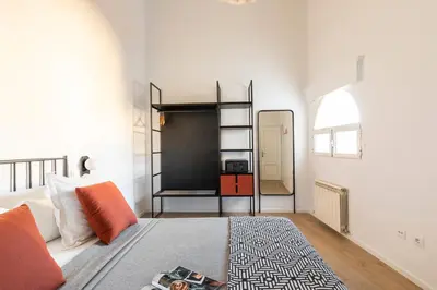 Cama o camas de una habitación en Aspasios Calle Mayor Apartments