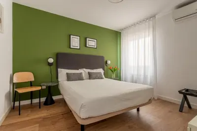 Cama o camas de una habitación en Aspasios Calle Mayor Apartments