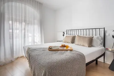 Cama o camas de una habitación en Aspasios Calle Mayor Apartments
