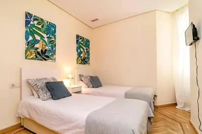 Cama o camas de una habitación en Velazquez Suites