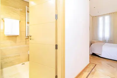 Cama o camas de una habitación en Velazquez Suites
