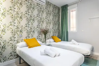 Cama o camas de una habitación en Waou Plaza de España II - Alquiler Corta Duración