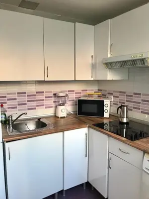 Una cocina o zona de cocina en Centro Madrid Rio - Monederos C