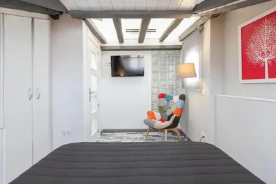 Una televisión o centro de entretenimiento en Luna Apartment