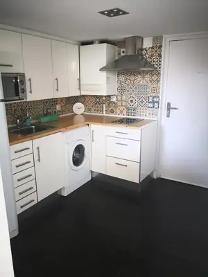 Una cocina o zona de cocina en Charming Apartment Madrid 57 m² + Internet
