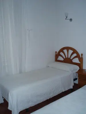 Cama o camas de una habitación en Hostal Castilla