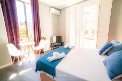 Cama o camas de una habitación en Apartments Madrid Plaza Mayor-Tintoreros