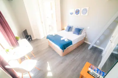 Cama o camas de una habitación en Apartments Madrid Plaza Mayor-Tintoreros