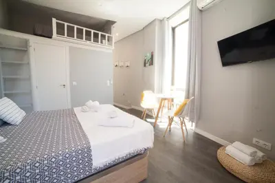 Cama o camas de una habitación en Apartments Madrid Plaza Mayor-Tintoreros