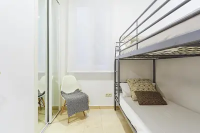 Cama o camas de una habitación en LEEWAYS APARTMENT VI in GRAN VÍA