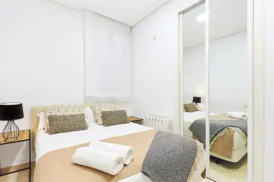 Cama o camas de una habitación en LEEWAYS APARTMENT VI in GRAN VÍA