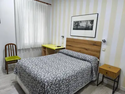 Cama o camas de una habitación en Hostal Angelines