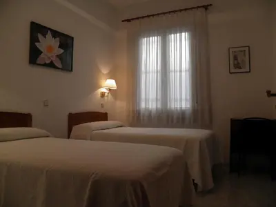 Cama o camas de una habitación en Hostal Angelines