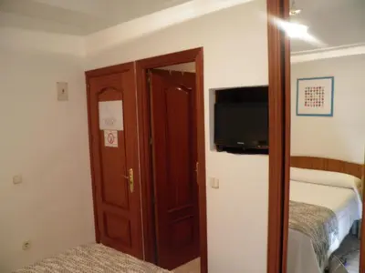 Cama o camas de una habitación en Hostal Angelines