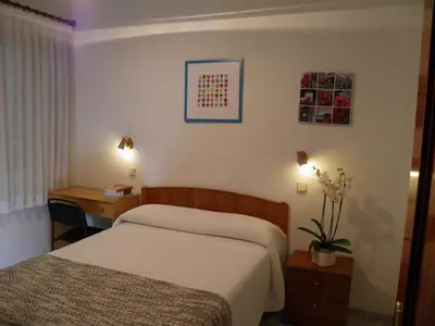 Cama o camas de una habitación en Hostal Angelines