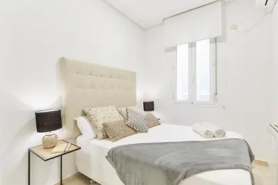 Cama o camas de una habitación en LEEWAYS APARTMENT XX in GRAN VÍA