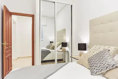 Cama o camas de una habitación en LEEWAYS APARTMENT XX in GRAN VÍA