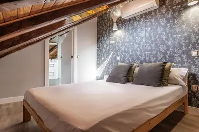 Cama o camas de una habitación en Waou Los Austrias II - Alquiler Corta Duración