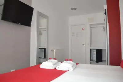 Cama o camas de una habitación en Hostal Madrid Sol