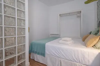 Cama o camas de una habitación en Gran Vía Fomento Apartment