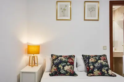 Cama o camas de una habitación en LEEWAYS APARTMENT I in GRAN VÍA