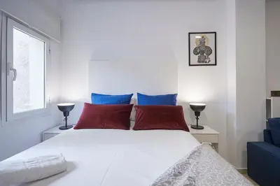 Cama o camas de una habitación en LEEWAYS APARTMENT XXII in GRAN VÍA
