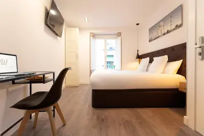 Cama o camas de una habitación en Woohoo Rooms Hortaleza