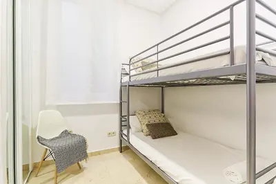 Cama o camas de una habitación en LEEWAYS APARTMENT XIX in GRAN VÍA