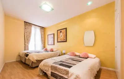 Cama o camas de una habitación en M&F FUENCARRAL