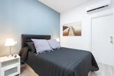 Cama o camas de una habitación en Plaza Mayor Apartment