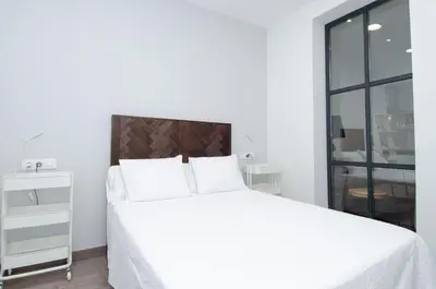 Cama o camas de una habitación en We Madrid Casa Duque