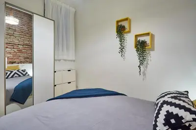Cama o camas de una habitación en LEEWAYS APARTMENT in ORIENTE