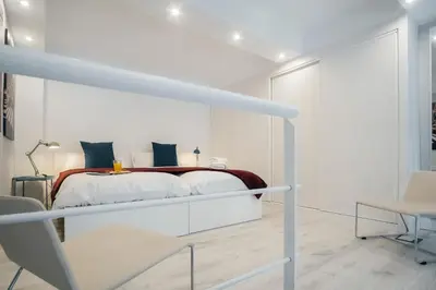 Cama o camas de una habitación en HOMEABOUT RETIRO Apartment II