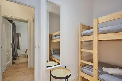 Cama o camas de una habitación en LEEWAYS APARTMENT in SAN BERNARDO