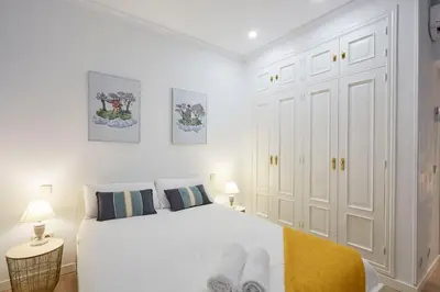 Cama o camas de una habitación en LEEWAYS APARTMENT in SAN BERNARDO