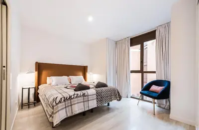 Cama o camas de una habitación en M&F MALASAÑA