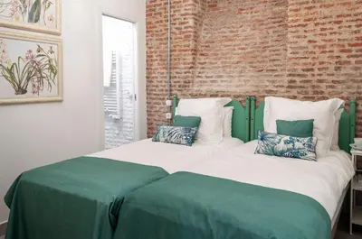 Cama o camas de una habitación en Cosy Apartment in the heart of Barrio de las Letras